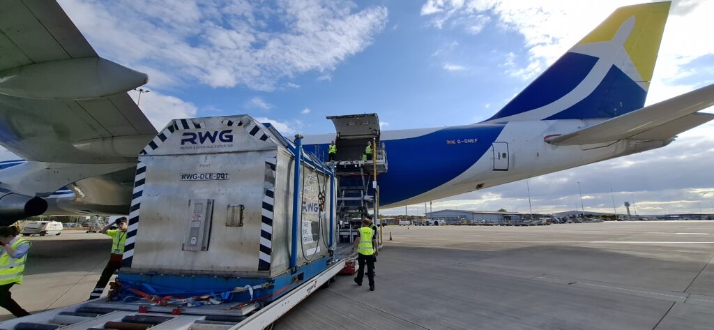 Industrial gas turbine being loaded into aircraft